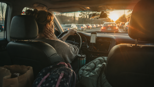 Busy mom driving through traffic, showing the challenge of staying connected with aging parents