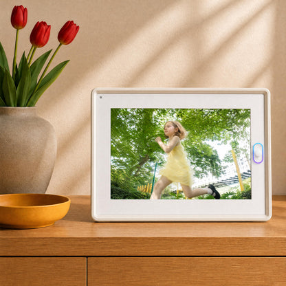 A grandma viewing family photos on the best digital frame, an ideal choice for long distance family gifts and comforting sentimental gifts for mom.