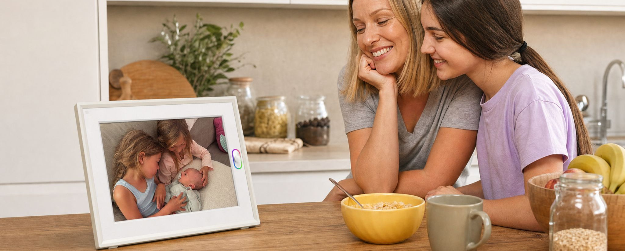 A smart picture frame displaying a family photo on a wooden cabinet, serving as a beautiful mother's day gift.